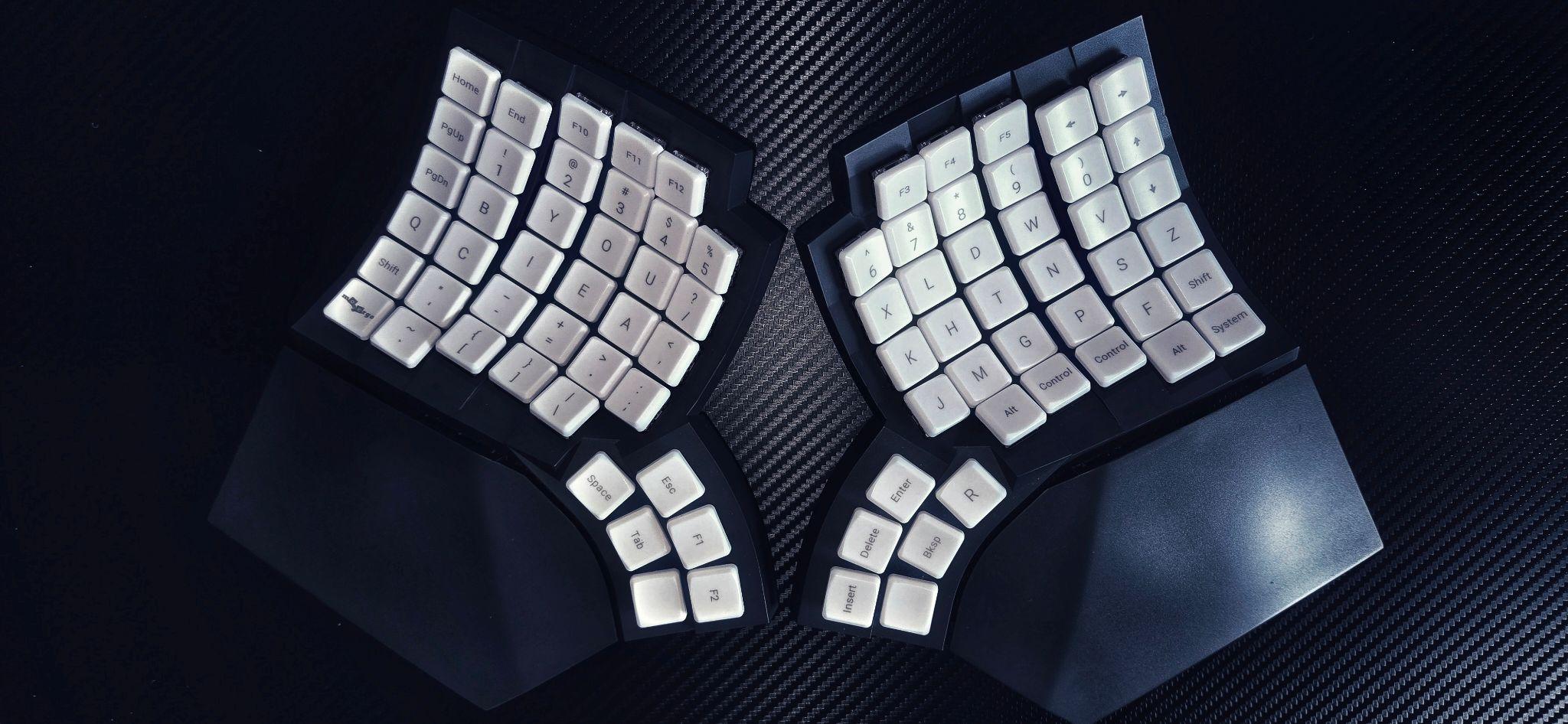 Photograph of my MoErgo Glove80 keyboard with Enthium layout, but without any illumination.